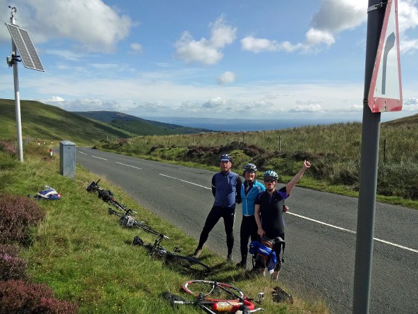 The team celebrates at the top of The String