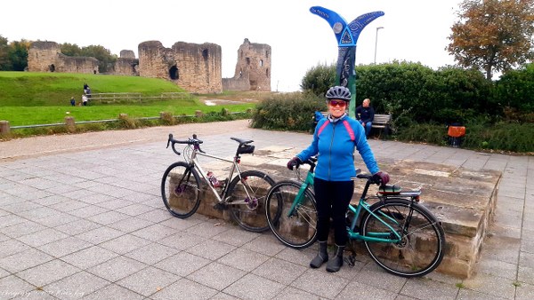 Helen by the NCN Route 5 post at Flint Castle