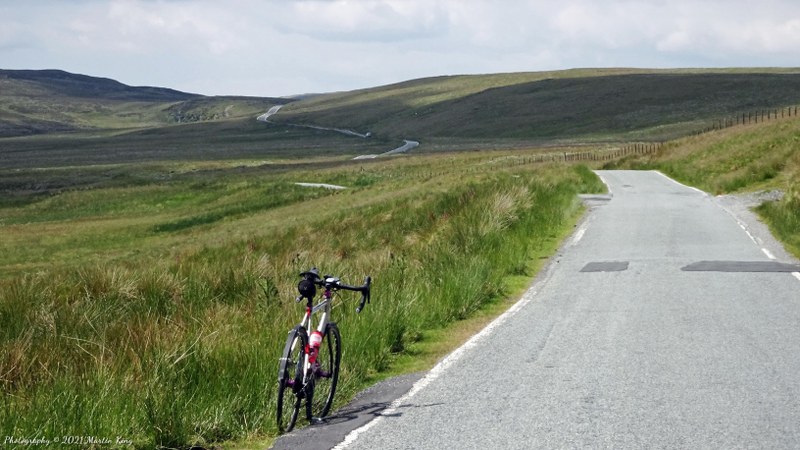 The mountain road winds across the Migneint wilderness