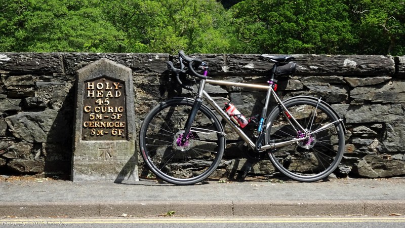 Decorating the milestone in Betwsy-y-coed