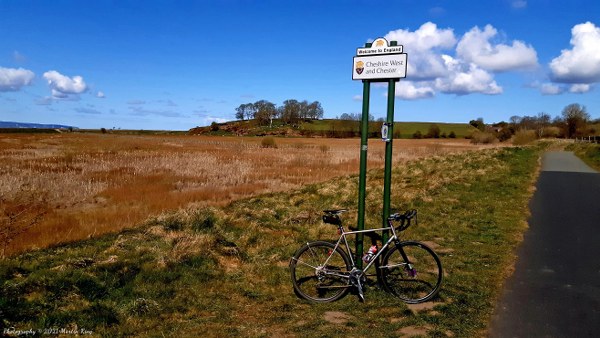 Riding across the Welsh-English border on Burton Marsh