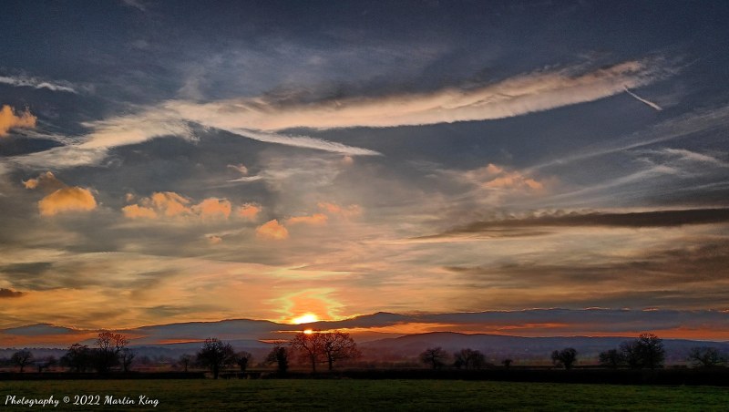 Atmospheric sunset skies over Hope Mountain